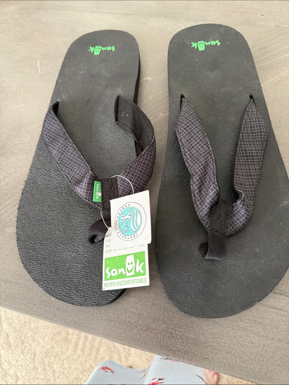 Sanuk Black Flip Sandals with Green Logo Accent